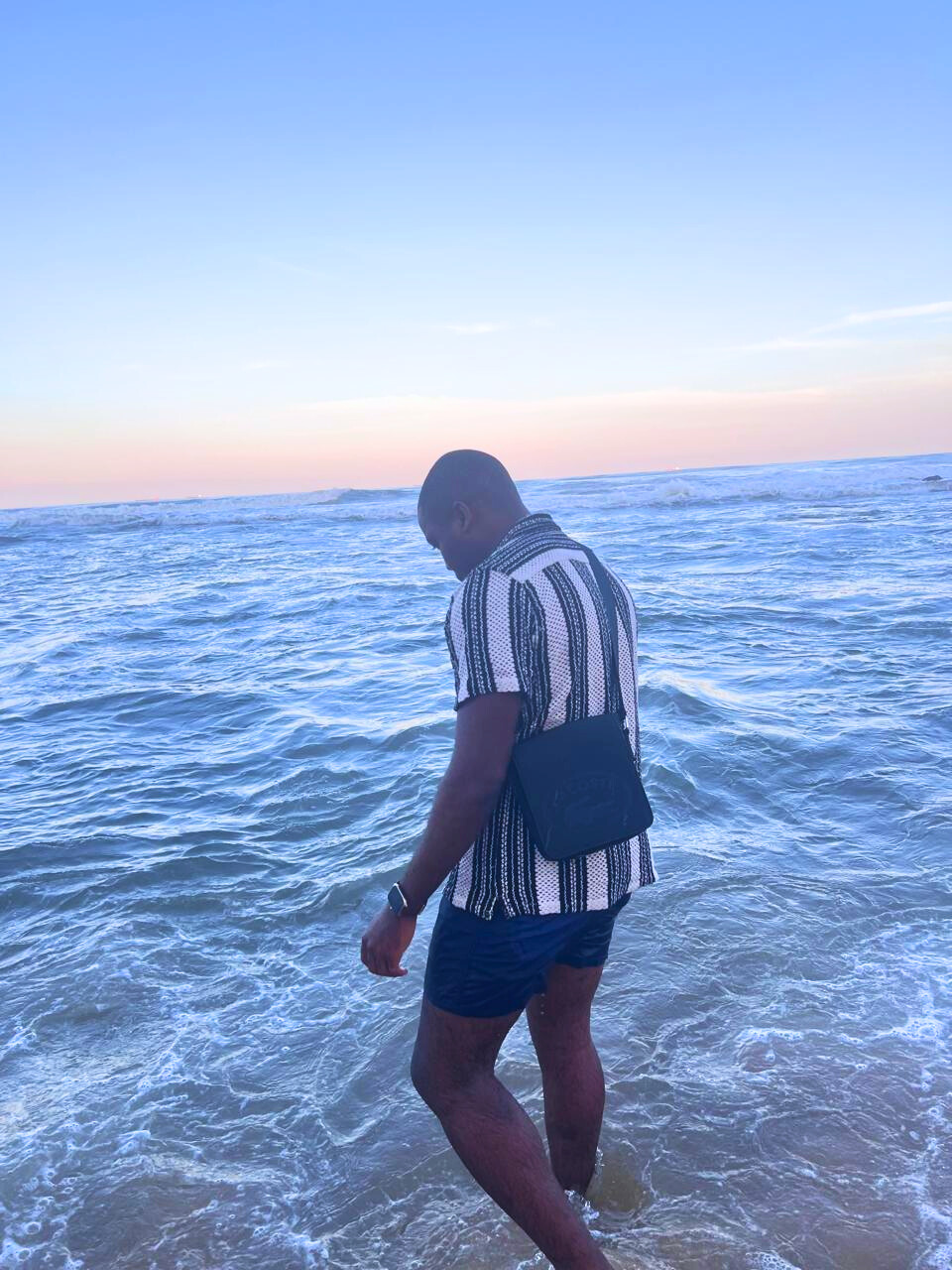 Randolphe Tanoguem — Zero walking by the ocean, symbolizing clarity, sovereignty, and self-realization | Real Success Ecosystem